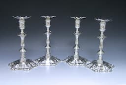 A Set of Four George II Antique Silver Candlesticks 1