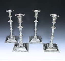A set of Four George III Cast Sterling Silver Candlesticks 1