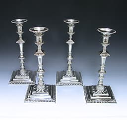 A set of Four George III Cast Sterling Silver Candlesticks 1