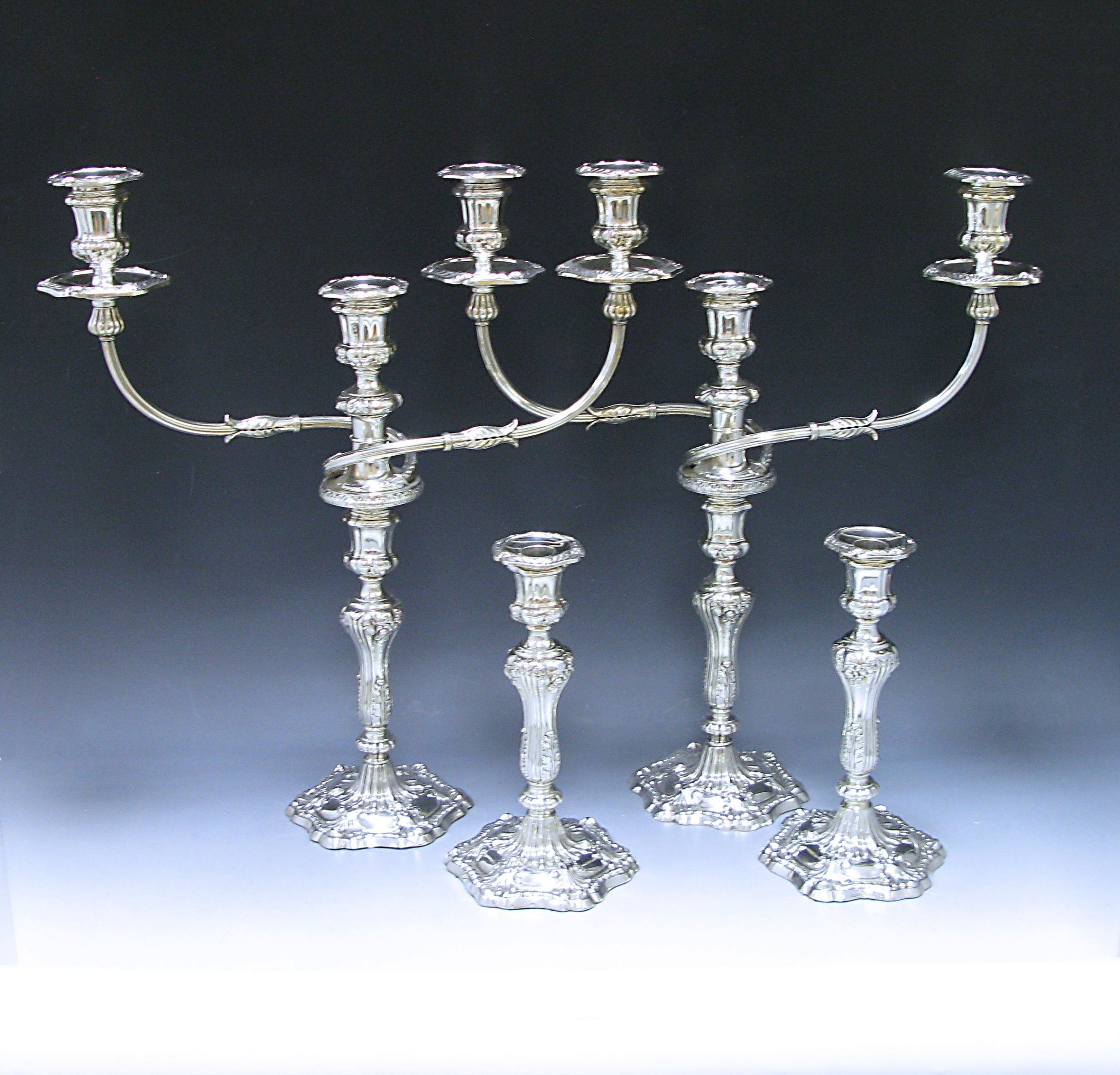 A Suite of George III Antique Silver  three light Candelabra and pair of Candlesticks 1