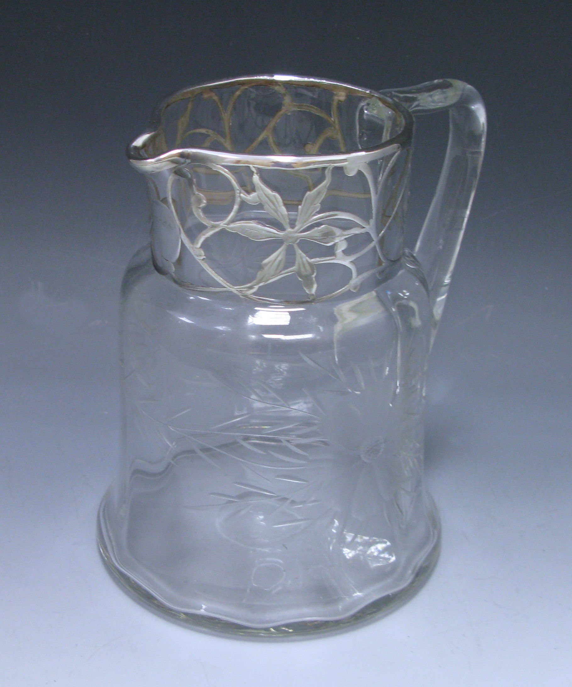 A Silver Overlaid Water Jug 1