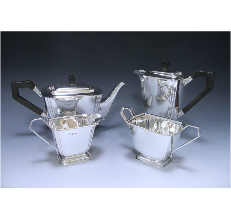 An Art Deco Silver Four- Piece Set