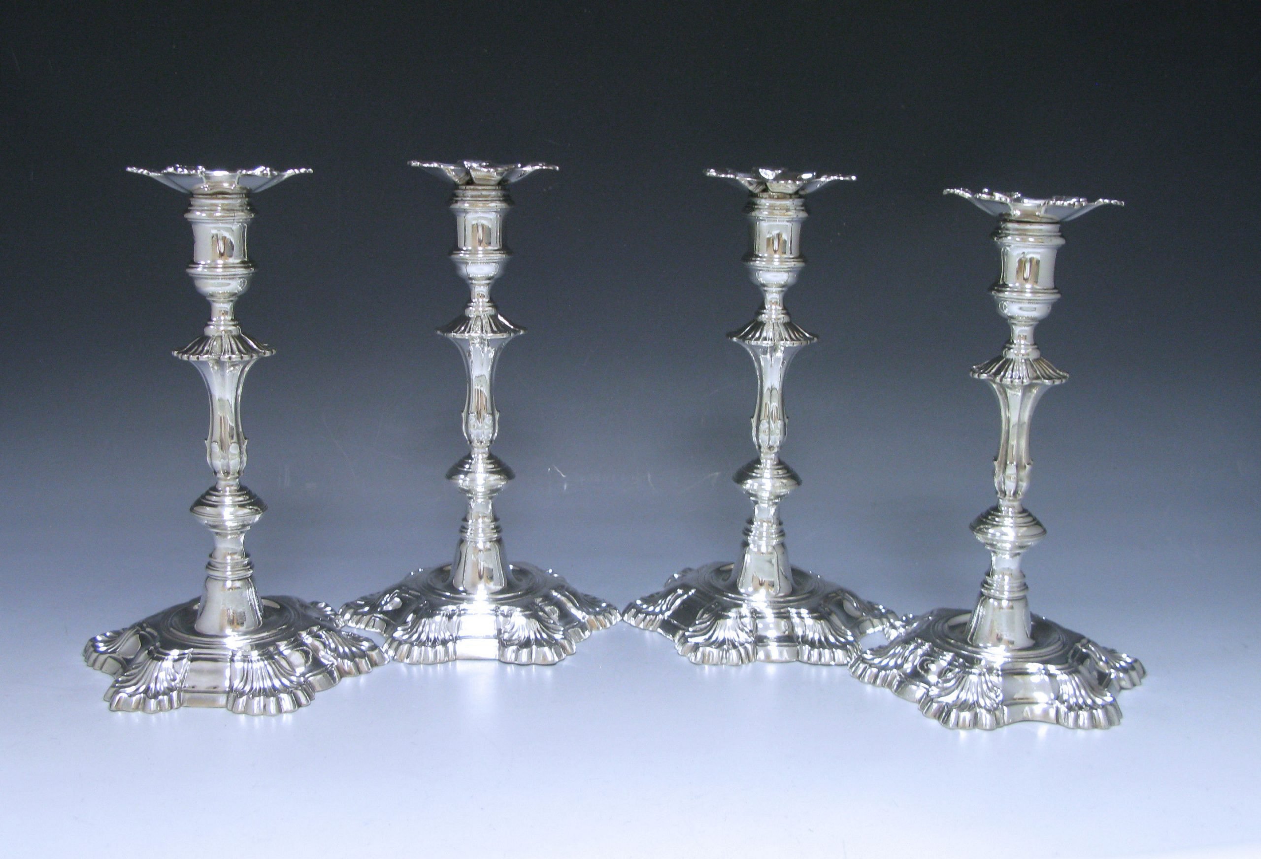 A Set of Four George II Antique Silver Candlesticks 1