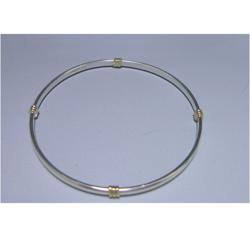 A Sterling Silver and 9ct Gold Bangle