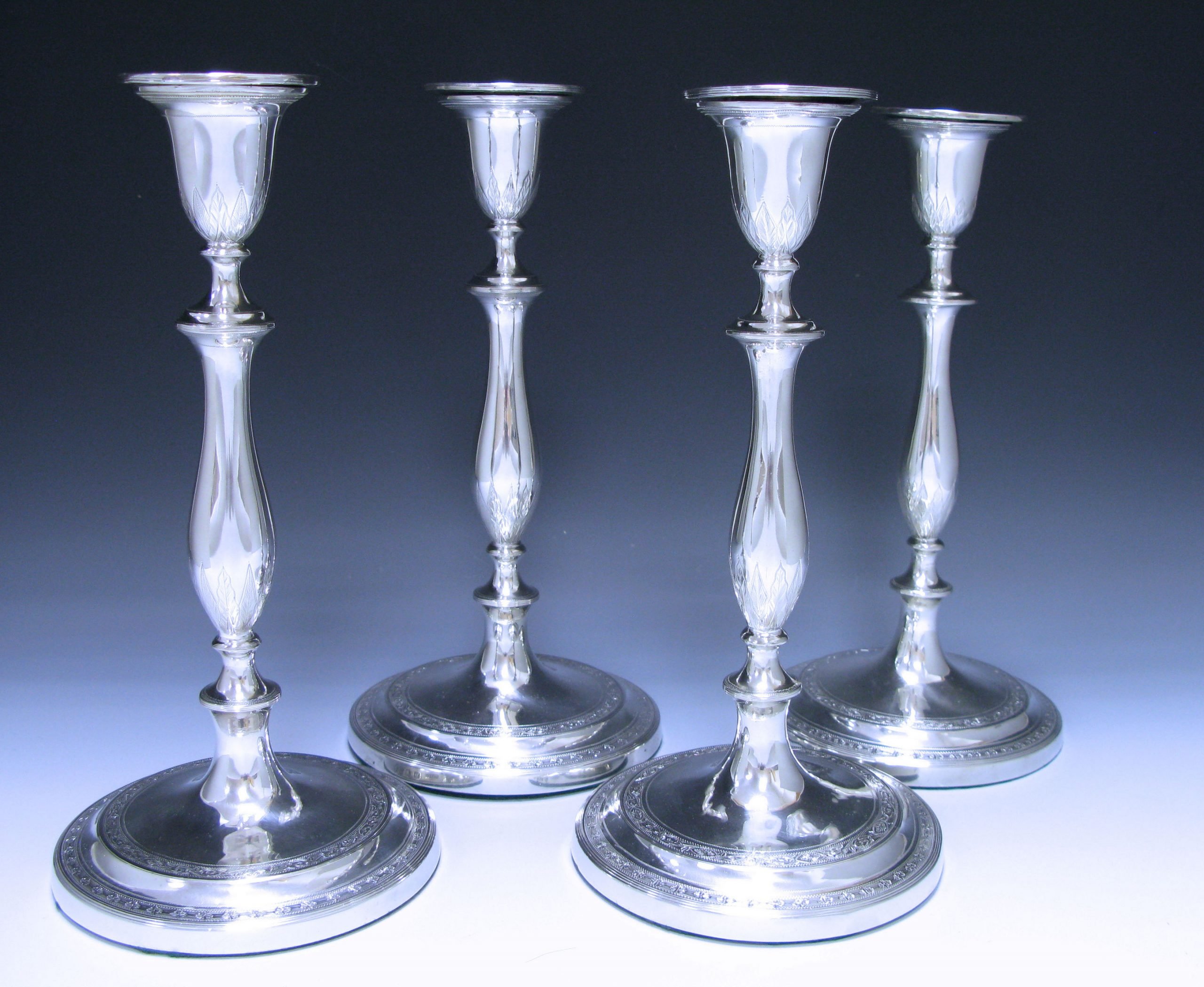 A Set of Four George III Antique Sterling Silver Candlesticks 1