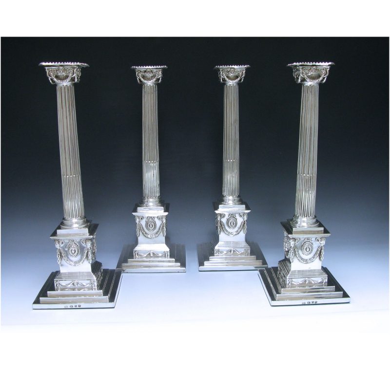 A Set of Four George III Sterling Silver Candlesticks.