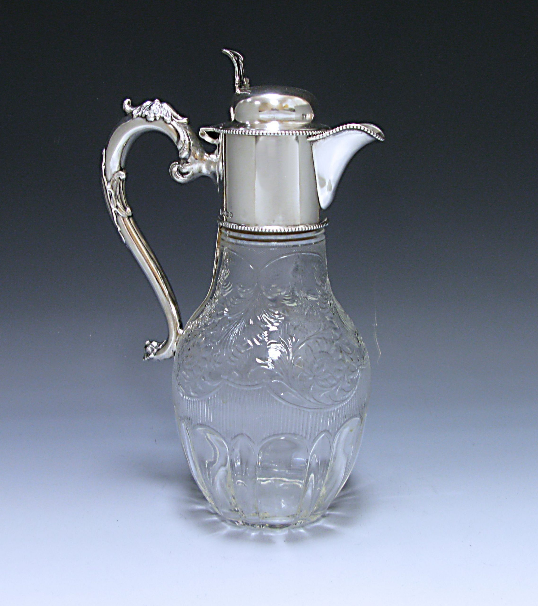 An Antique Silver and Glass Claret Jug  1